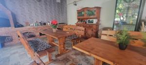 a dining room with a table and chairs and a table and a table and chairs at Vila Valeria in Techirghiol