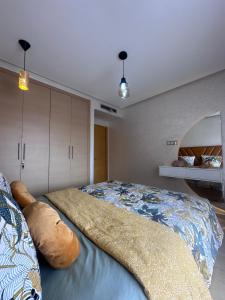 a bedroom with a large bed in a room at Luxury By Sana in Agadir +12 photos