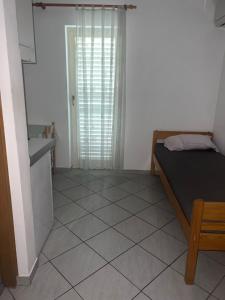Postel nebo postele na pokoji v ubytování Apartments Svekrić