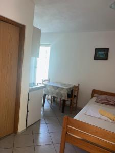 Postel nebo postele na pokoji v ubytování Apartments Svekrić