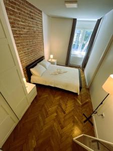 Postel nebo postele na pokoji v ubytování Knez Trpimir