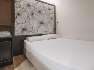 Postel nebo postele na pokoji v ubytování Hi Hotel Dot