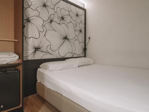 Postel nebo postele na pokoji v ubytování Hi Hotel Dot