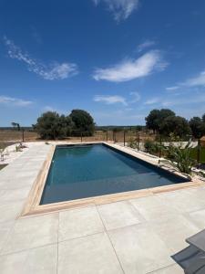 a swimming pool on the roof of a house at La Casa del Roc in Sainte-Colombe