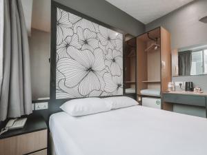 Postel nebo postele na pokoji v ubytování Hi Hotel Dot