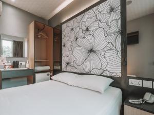 Postel nebo postele na pokoji v ubytování Hi Hotel Dot