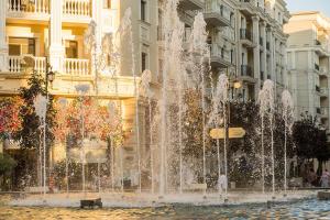 a water fountain in front of a building at 7, 8, Tashkent City Park, Boulevard, 51m2 in Tashkent