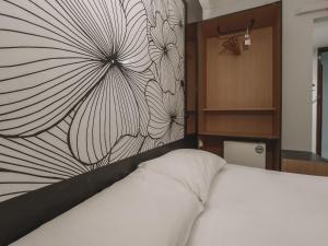 Postel nebo postele na pokoji v ubytování Hi Hotel Dot