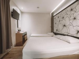 Postel nebo postele na pokoji v ubytování Hi Hotel Dot