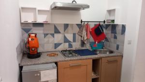 Η κουζίνα ή μικρή κουζίνα στο Casa Carina in Centro +7 φωτογραφίες