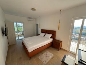 Postel nebo postele na pokoji v ubytování Magda apartments