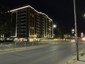 a large building on the side of a street at night at PlatinumHomes42 in Plovdiv
