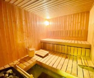 a small wooden sauna with a pool of water at What a view - very close to DMCC metro station in Dubai