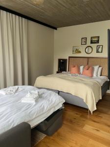 a bedroom with two beds in a room at Fritiden Hotell & Kongress in Ystad