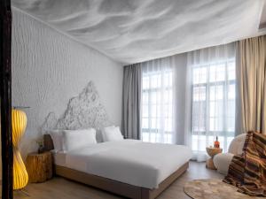 AM Manye Hotel 객실 침대