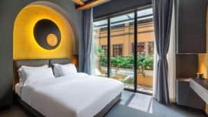 AM Manye Hotel 객실 침대
