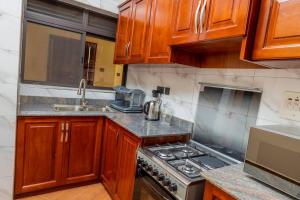 Photo de la galerie de l'établissement Stunning & Calm 2 bedroom gate away in Entebbe- Sand Grains Residences A03, à Namulanda