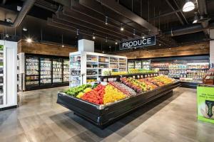 a produce section of a grocery store with fruits and vegetables at Casa Lago 5 Bed Waterfront House in Innisfil