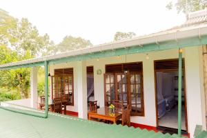 a house with a green roof at Samiru Guest Inn Ella in Ella