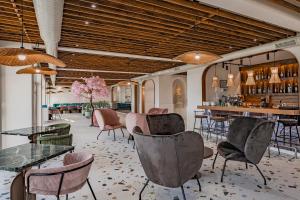 a restaurant with tables and chairs and a bar at Casa Deniso - The Home of Chill in Byala