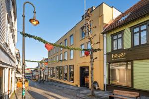 a street in a town with buildings and a street light at Penthouse, heart of city center, high standard in Stavanger