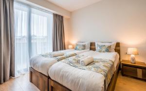 Voodi või voodid majutusasutuse New Gudauri NG Rooms toas