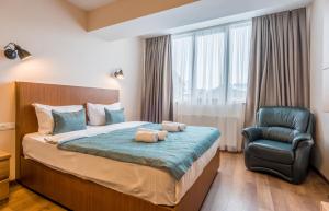Voodi või voodid majutusasutuse New Gudauri NG Rooms toas
