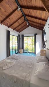 Postel nebo postele na pokoji v ubytování Zirkon Valley Boutique Hotel