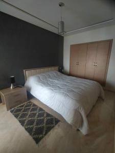 Una cama o camas en una habitación de Penthouse Residence les jardins d'Agadir