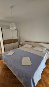 Postel nebo postele na pokoji v ubytování Apartment Jovanović + 5 fotografií