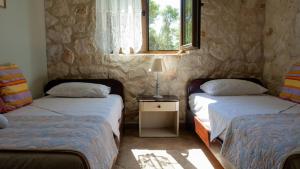 Ένα ή περισσότερα κρεβάτια σε δωμάτιο στο Fterini Apartments Sterna & Alletri