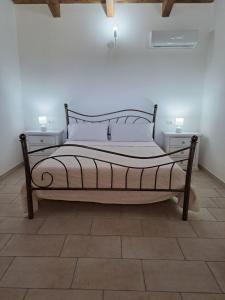 Postel nebo postele na pokoji v ubytování Agriturismo Sa Murta in Sennariolo-Oristano