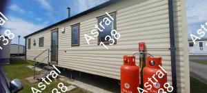 a mobile home with graffiti on the side of it at Astral 138 snowdon summit 098 in Barmouth