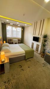 Letto o letti in una camera di RG Boutique Hotel