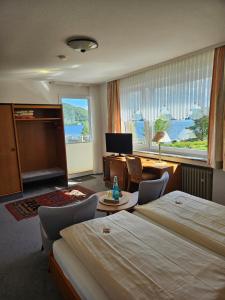 Postel nebo postele na pokoji v ubytování Seehotel Andree & Gästehaus Seehof