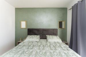a bedroom with a large bed with a white bedspread at Casa Coral in Crno +92 photos