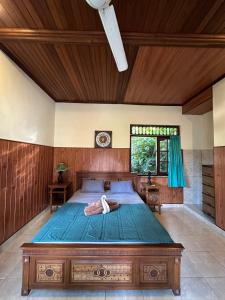 Postel nebo postele na pokoji v ubytování Kajeng Bungalow
