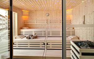 a sauna with two saucers in a wooden building at Grand Hotel Des Sablettes Plage, Curio Collection By Hilton in La Seyne-sur-Mer