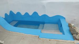 a blue painting on the side of a building at La Ballena Azul in Los Silos