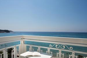 a balcony with a view of the ocean at Grand Hotel Des Sablettes Plage, Curio Collection By Hilton in La Seyne-sur-Mer