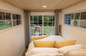 a living room with a couch and a window at Schuyler Yacht Basin in Schuylerville