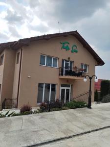 a building with the words the ego painted on it at Pensiunea Tulip in Baile Felix