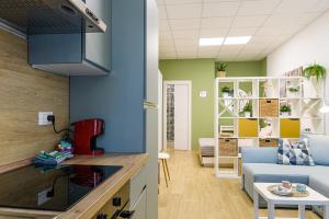 a living room with a couch and a table at Open Space Romagna 14 in San Benedetto del Tronto