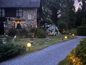 a garden with lights in front of a house at Villa spacieuse à Haut-de-Bosdarros avec piscine privée in Haut-de-Bosdarros +36 photos
