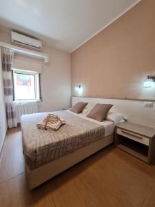 Ένα ή περισσότερα κρεβάτια σε δωμάτιο στο b&b la casa di Martina