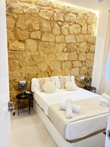 Ένα ή περισσότερα κρεβάτια σε δωμάτιο στο Carolinas Suites by Coqueto