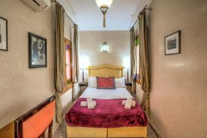 Letto o letti in una camera di Riad Inaka