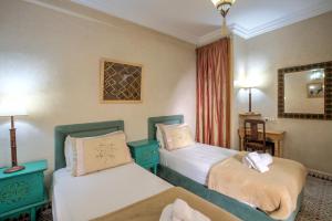 Letto o letti in una camera di Riad Inaka