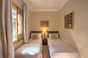 Letto o letti in una camera di Riad Inaka