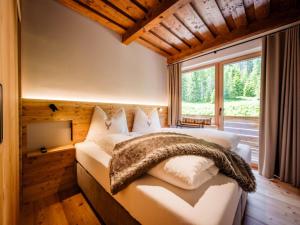 Postel nebo postele na pokoji v ubytování Nockalmhof Top 3